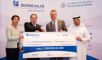 In the middle/standing; Mark Garrett, Borealis Chief Executive and Dr Kenneth Vedra, Director General of the Emirates National Schools at Borealis Social Fund event